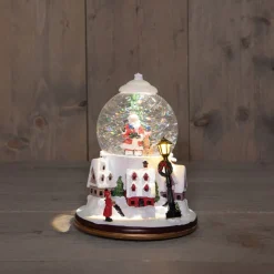 Anna's Collection automatische sneeuwbol dorp kerstman met verlichting D 18,5 H 24,5 cm