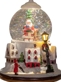 Anna's Collection automatische sneeuwbol dorp kerstman met verlichting D 18,5 H 24,5 cm