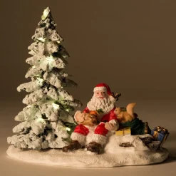 Intratuin kerstdorpminiatuur kerstman bij boom 13 x 9 x 12 cm