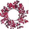 Krans met bessen en rozenbottels D 12/25 cm